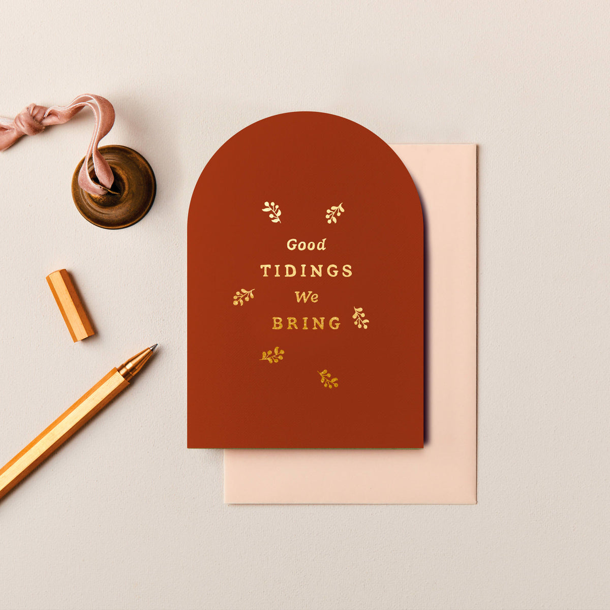 Rust arched Good Tidings Christmas card with gold foil botanical details
