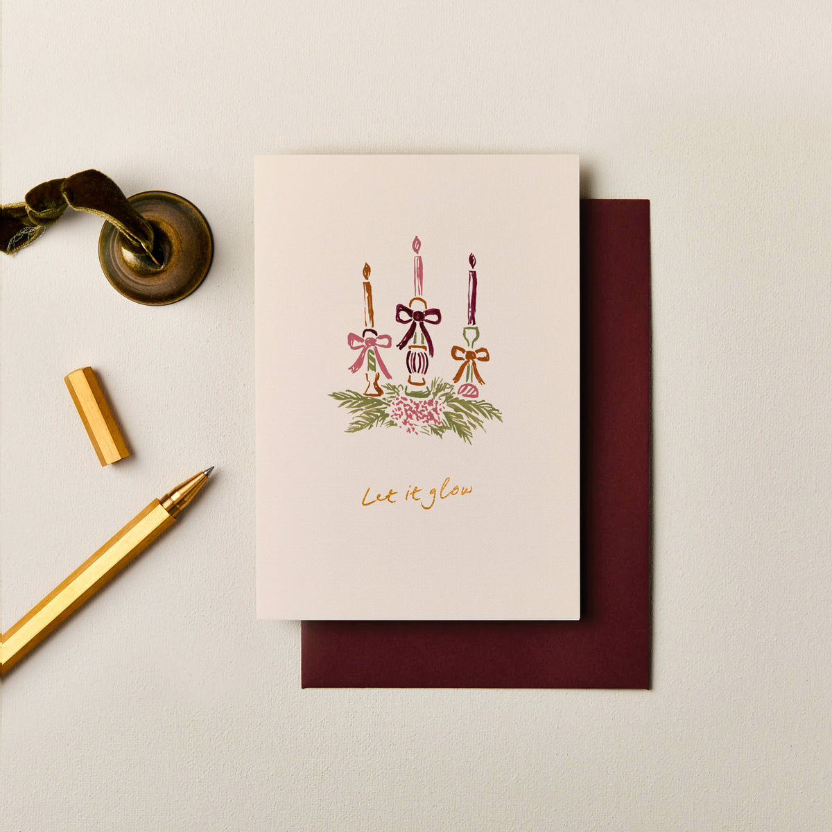 Hand painted festive candle Christmas card with gold foil Let It Glow lettering